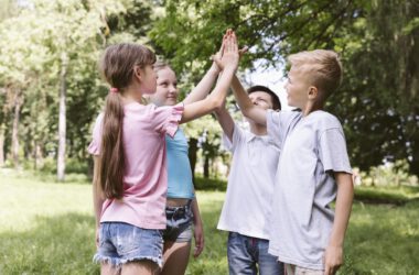 medium shot kids high fiving before match